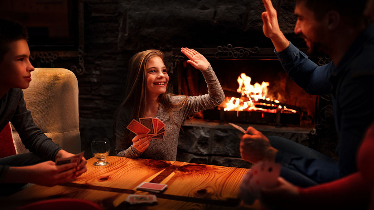 Family playing a card game in a power outage.