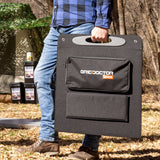 Person carrying the Grid Doctor 200W solar panel, securely enclosed in its custom-fit carrying case, illustrating the panel's portability.