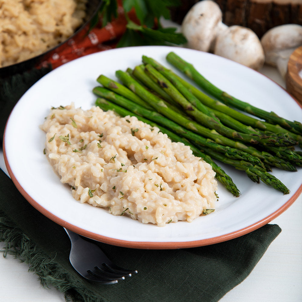Ready Hour's Mushroom Rice Pilaf on a plate with asparagus