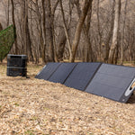 Portable foldable solar panels for the Grid Doctor 3300 System in the woods