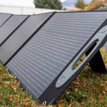 Portable foldable solar panels for the Grid Doctor 3300 System in the woods close up