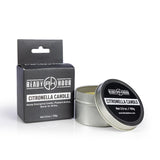 citronella candle by ready hour sitting next to packaging 