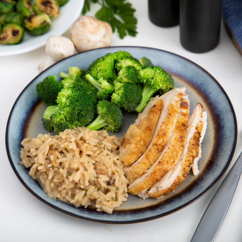 Dinner plate with chicken, broccoli, and Ready Hour's Mushroom Rice Pilaf
